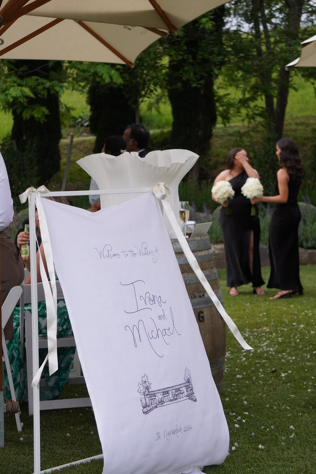 Linen welcome sign with custom sketched venue