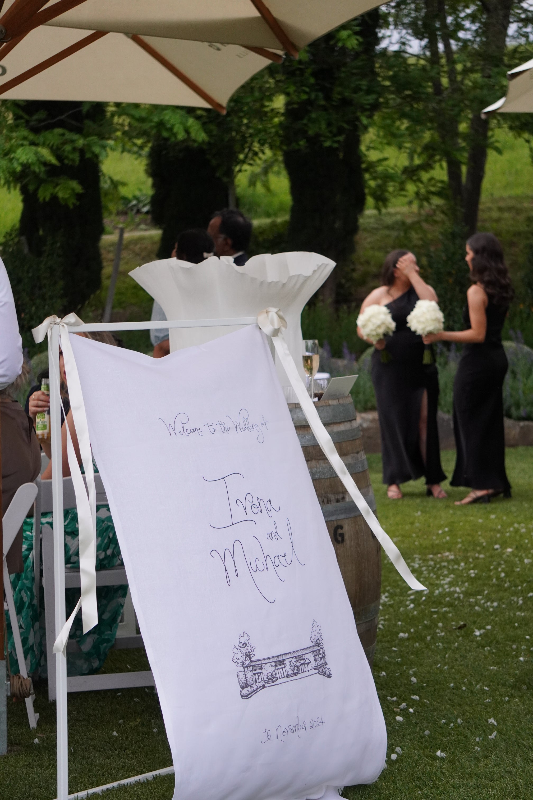 Linen welcome sign with custom sketched venue